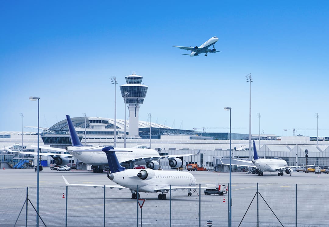 Plane taking off near control tower